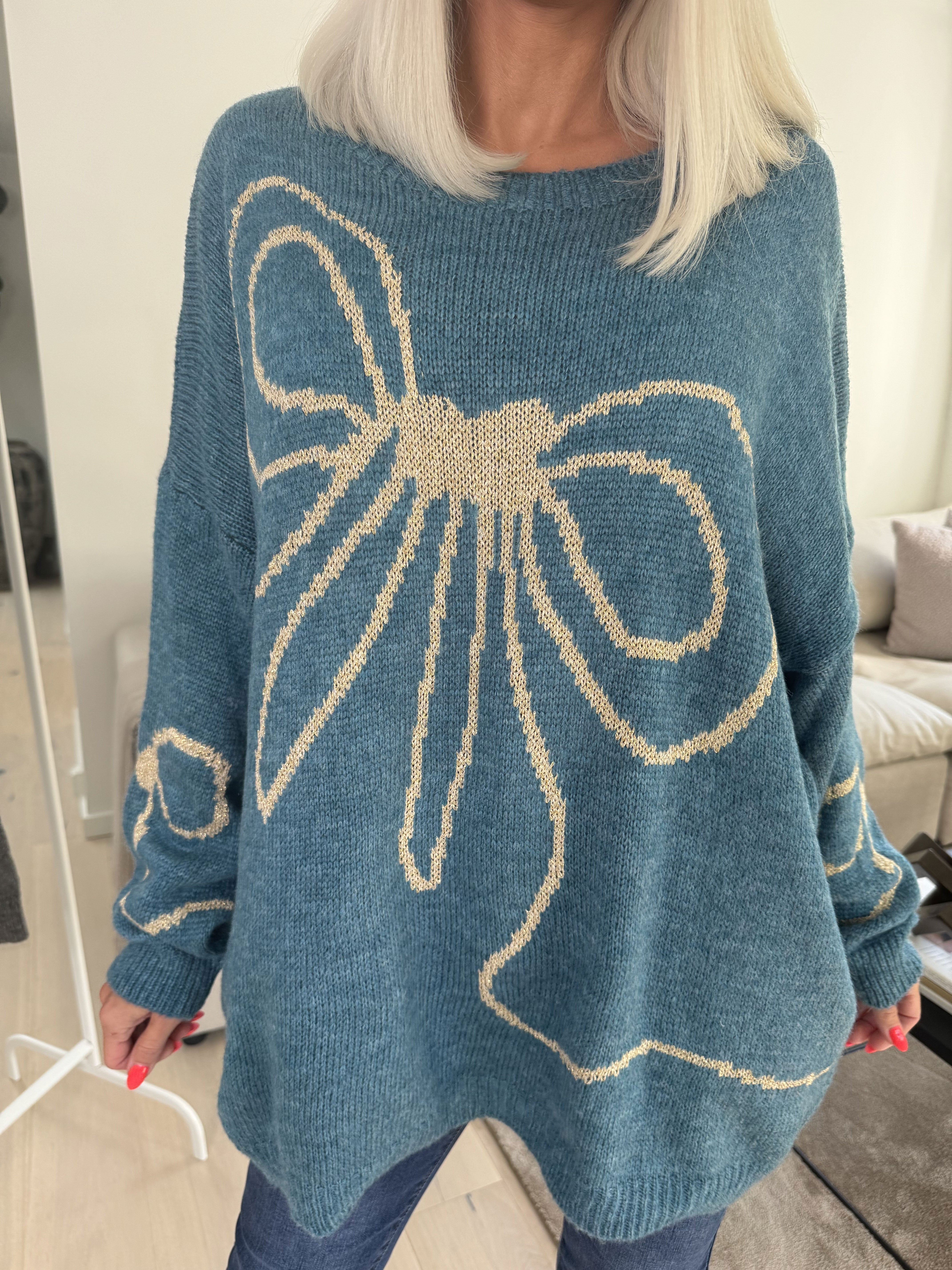 Ruby - Stickad tröja med ull och rosett i guldtråd